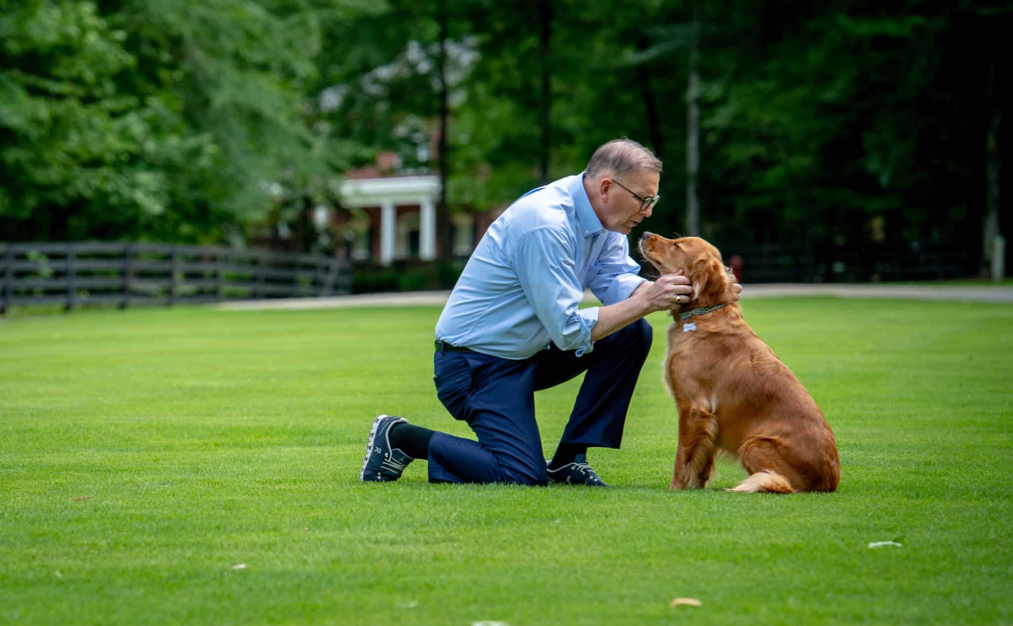 Attorney petting golden retriever
